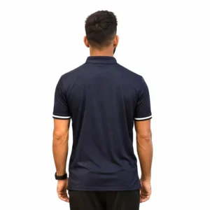 A person with short dark hair is shown from the back wearing a dark blue polo shirt with white striped sleeves against a plain white background.