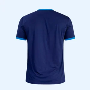 A man stands with his back to the camera, wearing a navy blue athletic shirt with light blue trim, conveying a casual, sporty vibe.