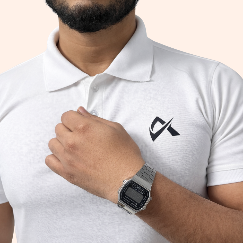 A man dressed in a white polo shirt and a watch, representing the Athlayer White Solid Casual Polo T-Shirt for Men.