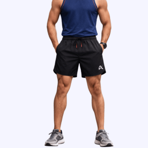 Front pose of a man wearing a blue tank top and black running shorts, exuding a sporty and stylish vibe.