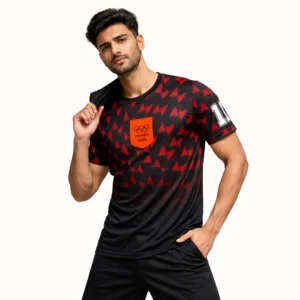 A man wearing a black and red Olympic Dri-FIT soccer jersey, showcasing a sporty and athletic look.